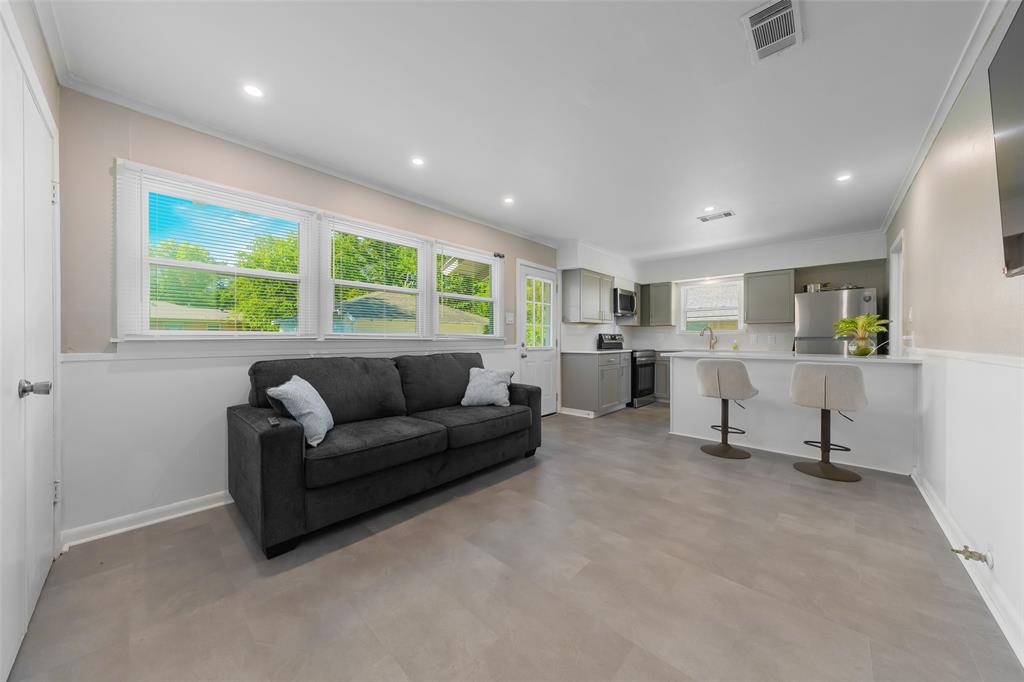 804 Haggard Street Plano, TX 75074 - Photo 11 of 40 a living room with furniture and floor to ceiling window
