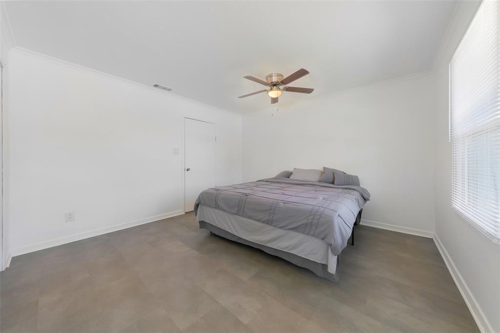 804 Haggard Street Plano, TX 75074 - Photo 19 of 40 a bedroom with a bed and a window