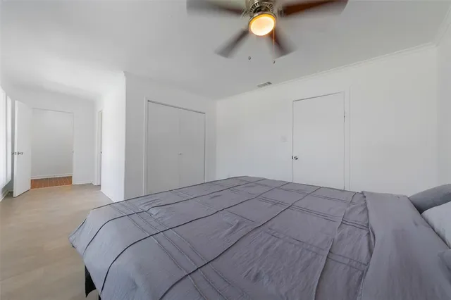 a bedroom with a bed and a table