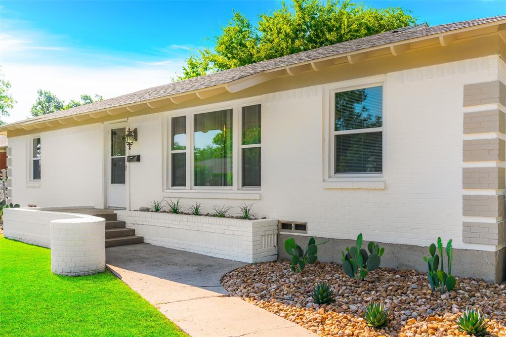 804 Haggard Street Plano, TX 75074 - Photo 2 of 40 a front view of a house with garden
