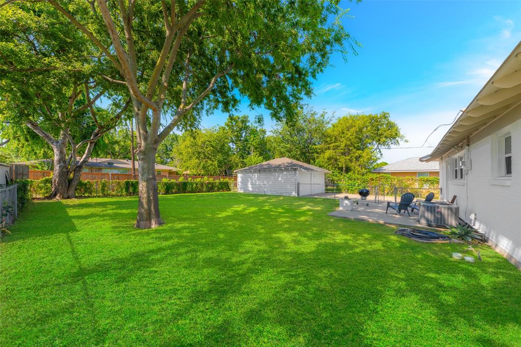 804 Haggard Street Plano, TX 75074 - Photo 31 of 40 a front view of a house with patio and garden