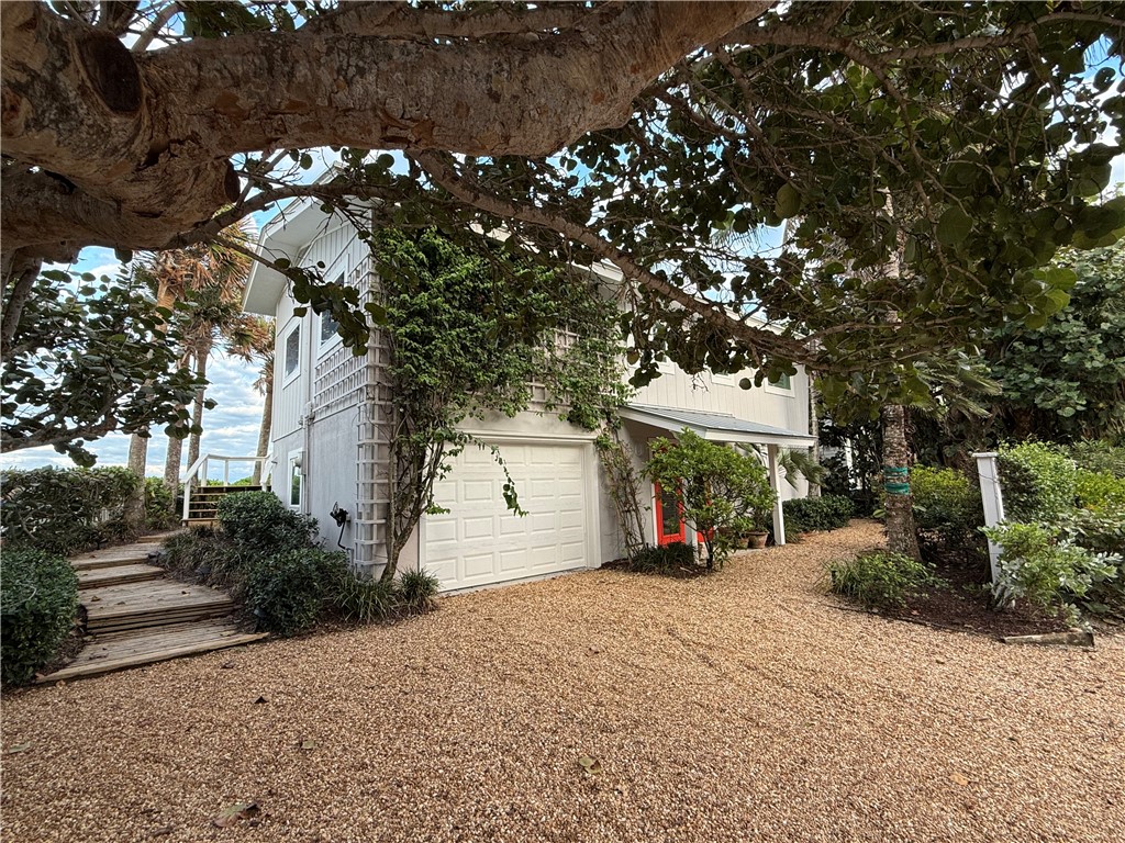 9490 Doubloon Drive Vero Beach, FL 32963 - Photo 35 of 35 a view of a house with a tree