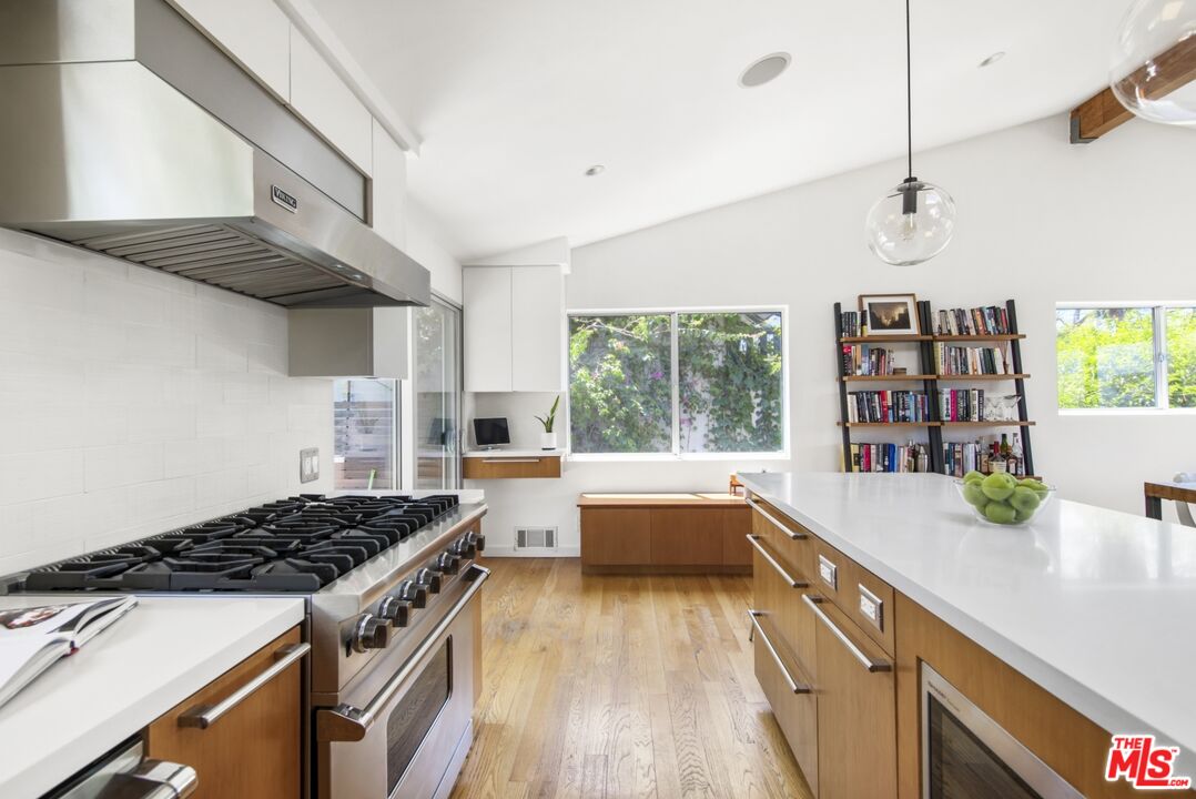 1423 Elevado Street Los Angeles, CA 90026 - Photo 14 of 51 a kitchen that has a sink and a stove
