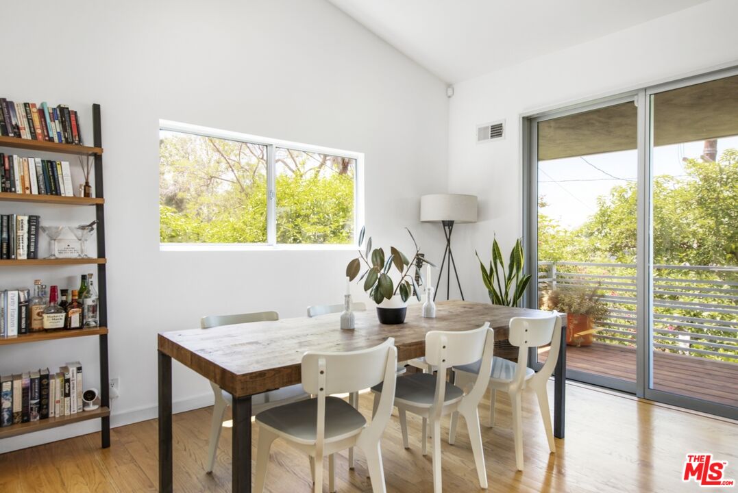 1423 Elevado Street Los Angeles, CA 90026 - Photo 15 of 51 a view of a dining room with furniture window and wooden floor