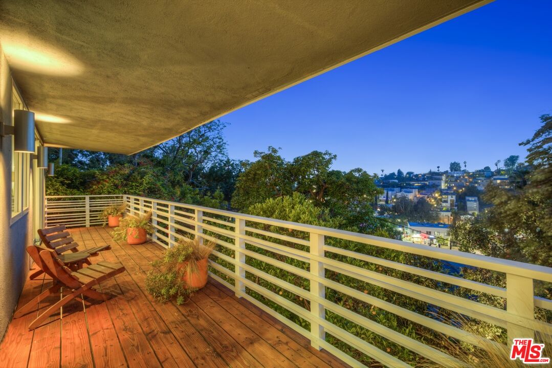 1423 Elevado Street Los Angeles, CA 90026 - Photo 17 of 51 a view of balcony with wooden floor and city view
