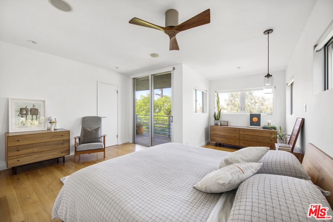 1423 Elevado Street Los Angeles, CA 90026 - Photo 21 of 51 a bedroom with furniture and a large window