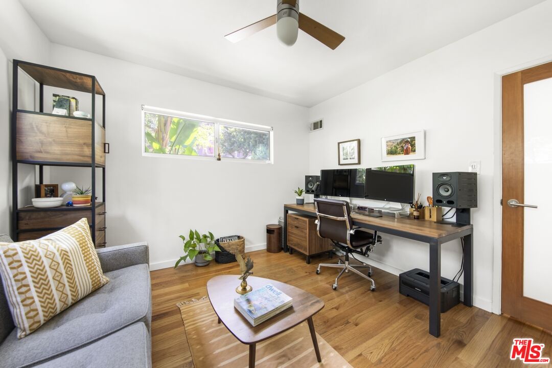 1423 Elevado Street Los Angeles, CA 90026 - Photo 24 of 51 a living room with furniture and a flat screen tv
