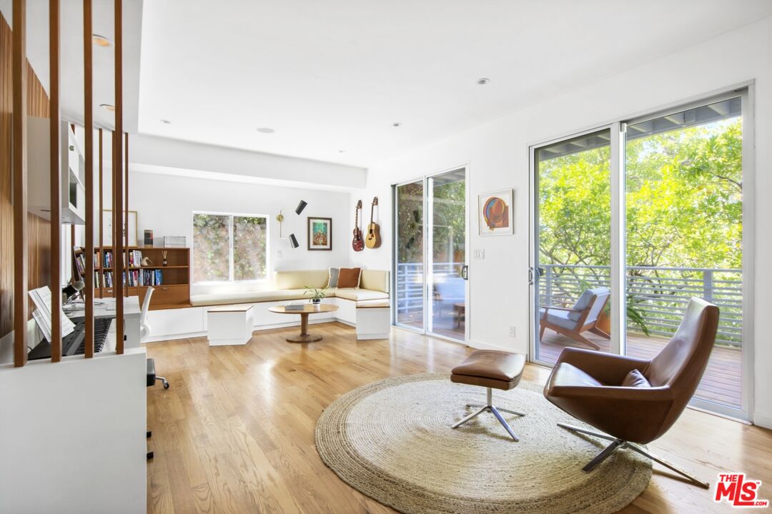 1423 Elevado Street Los Angeles, CA 90026 - Photo 28 of 51 a living room with fireplace furniture and a large window