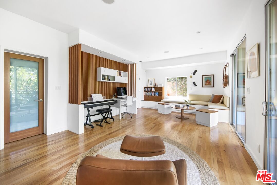 1423 Elevado Street Los Angeles, CA 90026 - Photo 29 of 51 a living room with furniture and a wooden floor