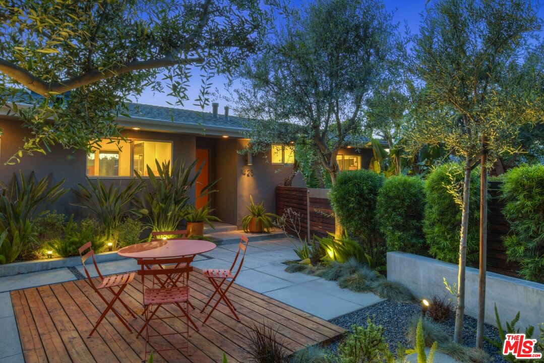 1423 Elevado Street Los Angeles, CA 90026 - Photo 3 of 51 a view of a chairs and table in patio with a fire pit