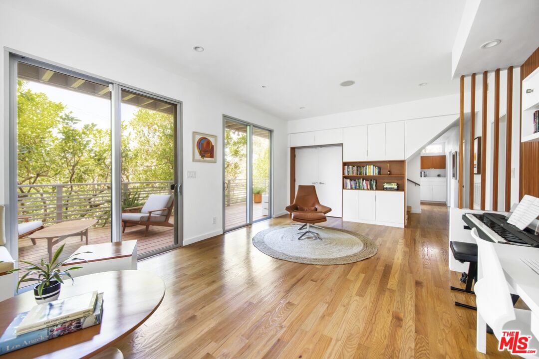 1423 Elevado Street Los Angeles, CA 90026 - Photo 31 of 51 a living room with furniture and floor to ceiling windows