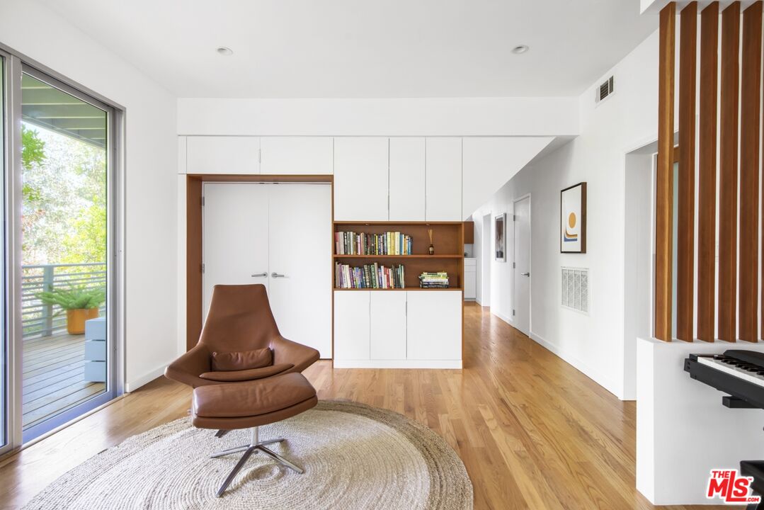 1423 Elevado Street Los Angeles, CA 90026 - Photo 32 of 51 a living room with furniture and a wooden floor