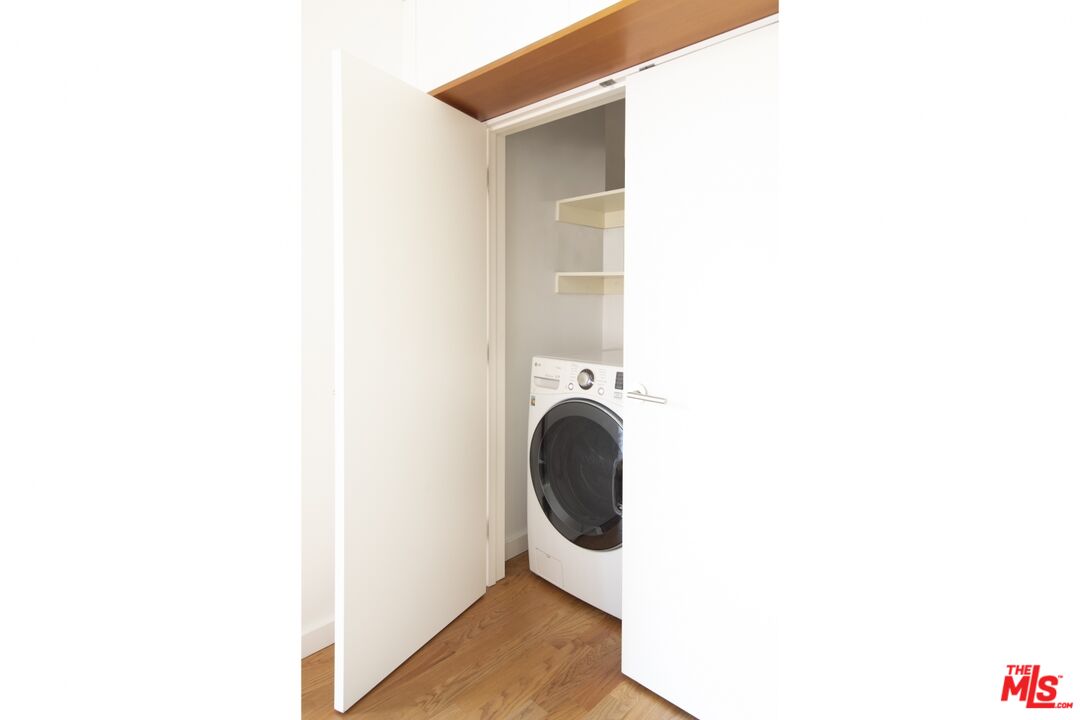 1423 Elevado Street Los Angeles, CA 90026 - Photo 34 of 51 a bathroom with sink and mirror