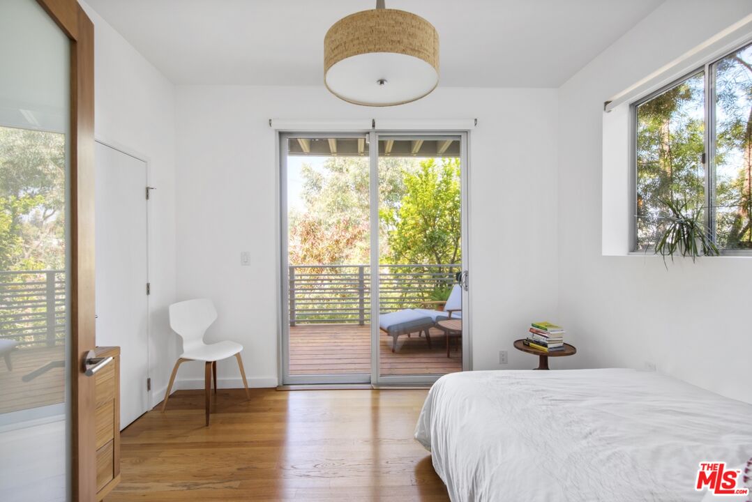 1423 Elevado Street Los Angeles, CA 90026 - Photo 35 of 51 a bedroom with a bed and a large window