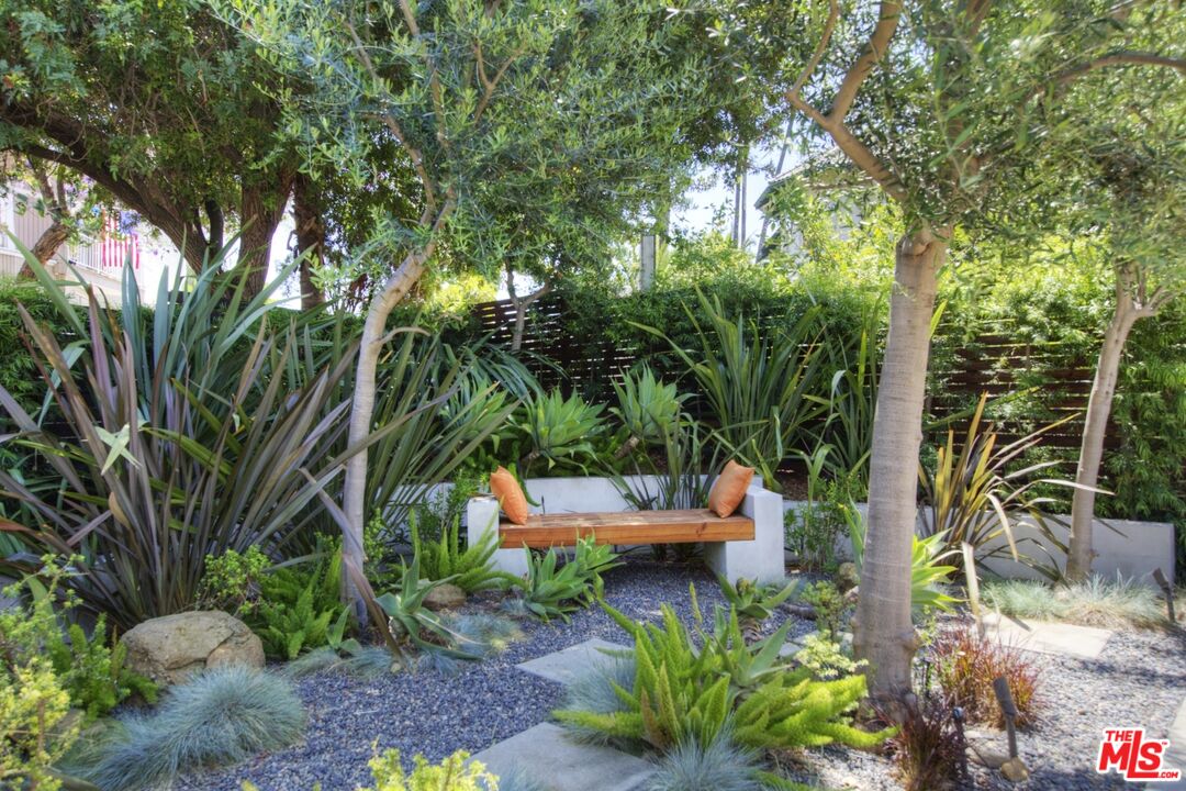 1423 Elevado Street Los Angeles, CA 90026 - Photo 49 of 51 an outdoor sitting area with lots of trees