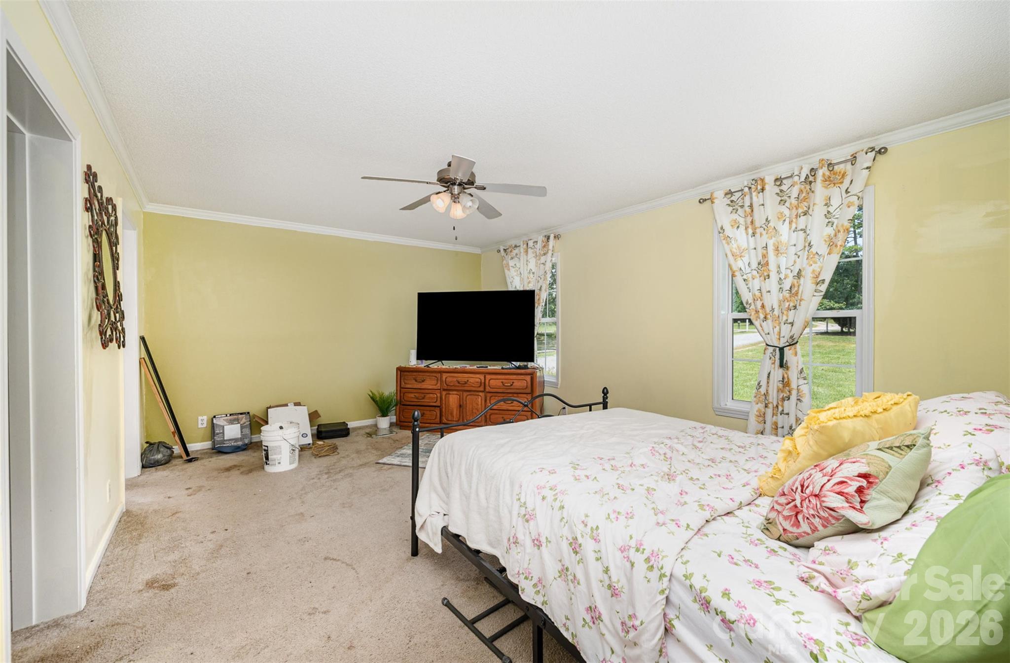 5602 Flint Ridge Marshville, NC 28103 - Photo 21 of 26 a bedroom with a bed and a flat screen tv