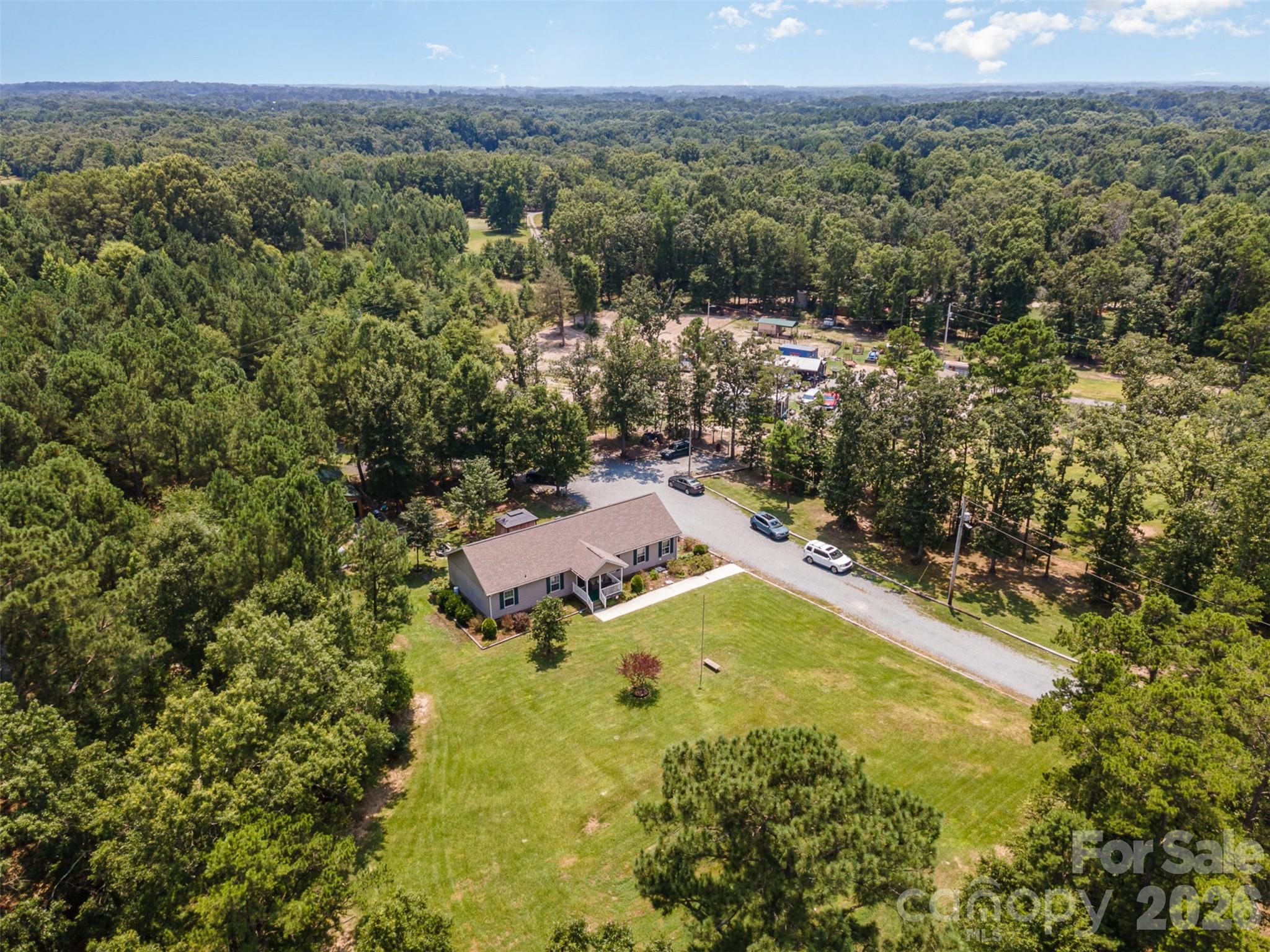 5602 Flint Ridge Marshville, NC 28103 - Photo 23 of 26 an aerial view of residential houses with outdoor space and trees