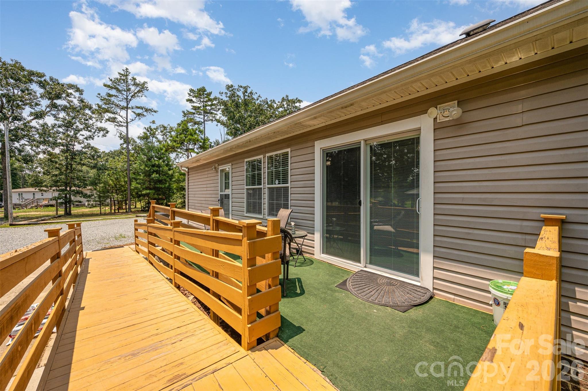 5602 Flint Ridge Marshville, NC 28103 - Photo 4 of 26 a view of a patio with chairs next to a yard