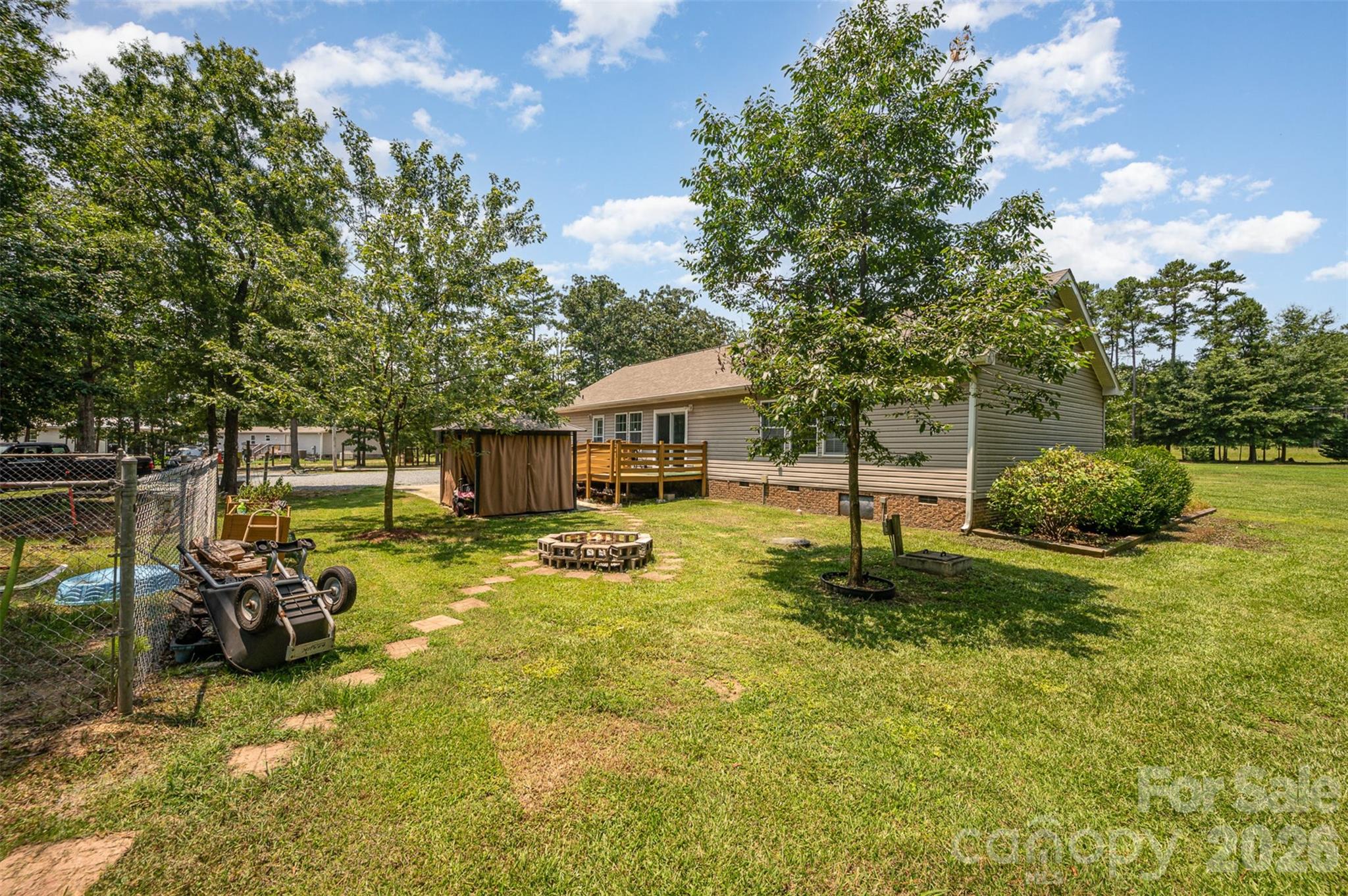 5602 Flint Ridge Marshville, NC 28103 - Photo 6 of 26 a swimming pool with wooden fence
