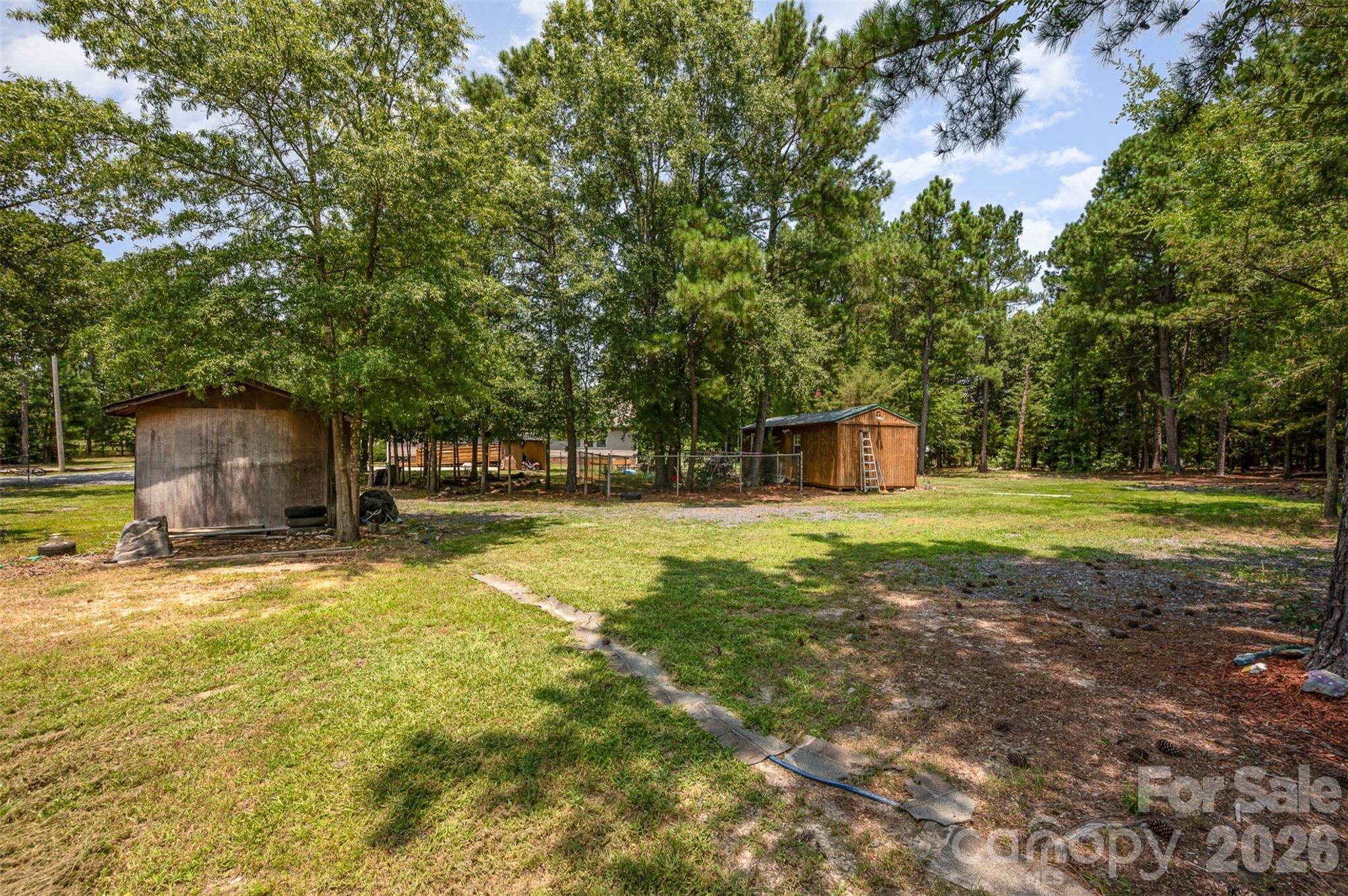 5602 Flint Ridge Marshville, NC 28103 - Photo 7 of 26 a view of a house with a yard