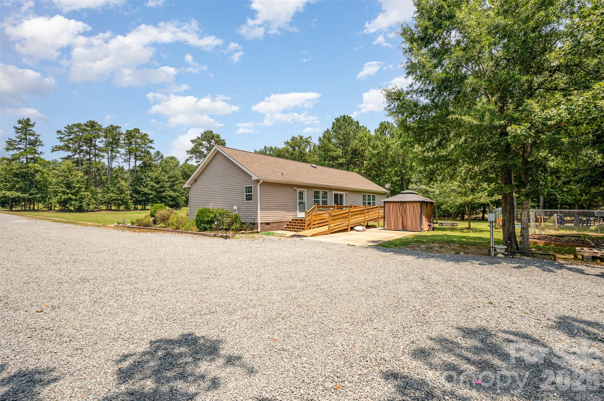 5602 Flint Ridge Marshville, NC 28103 - Photo 9 of 26 a front view of a house with a yard and garage