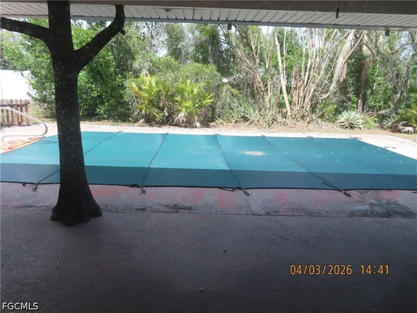 a view of backyard with green space