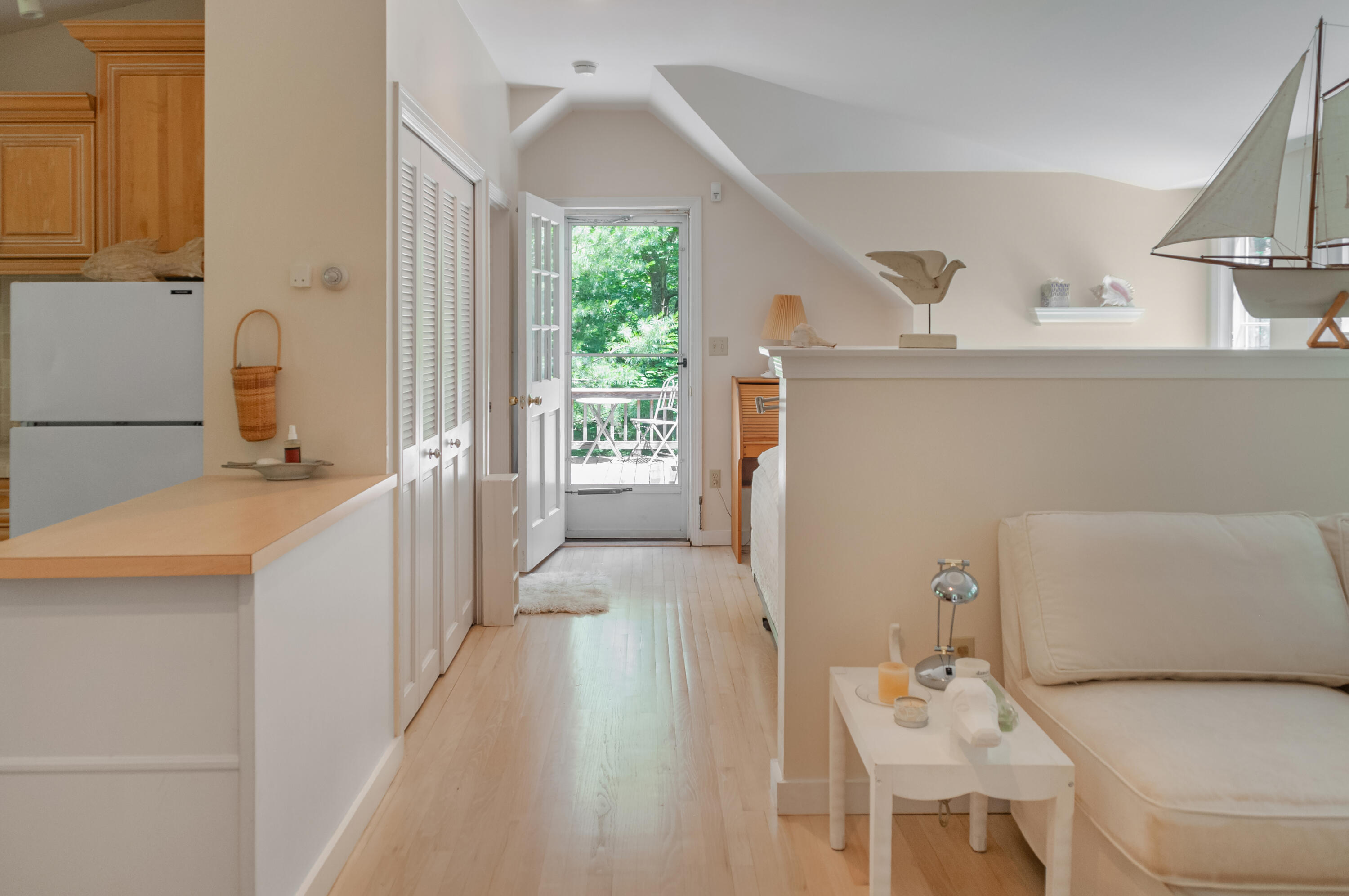 23 Paula Lane Cotuit, MA 02635 - Photo 17 of 23 a hallway with a view of living room with furniture and a window