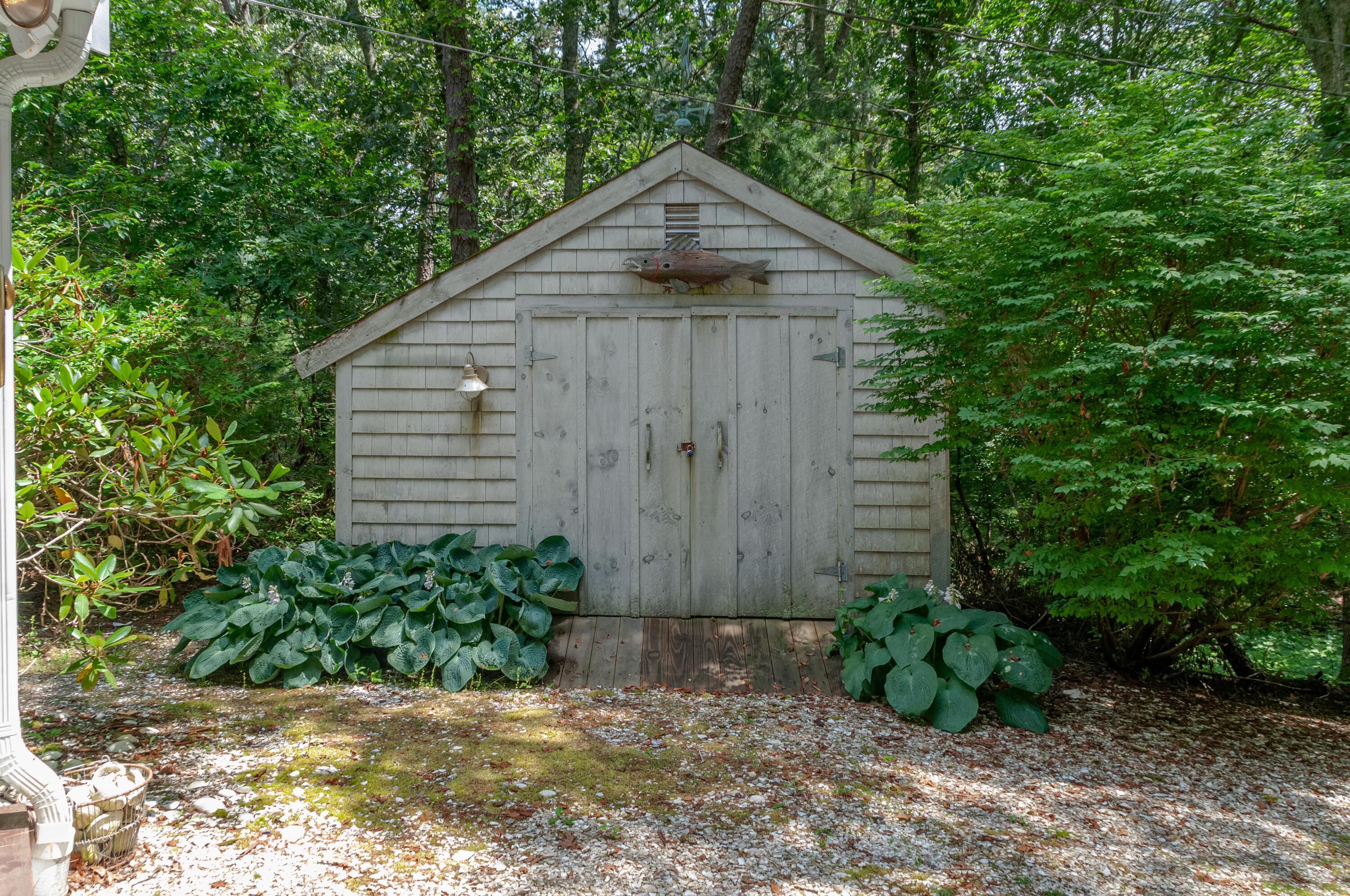 23 Paula Lane Cotuit, MA 02635 - Photo 23 of 23 a wooden fence with some plants in the background