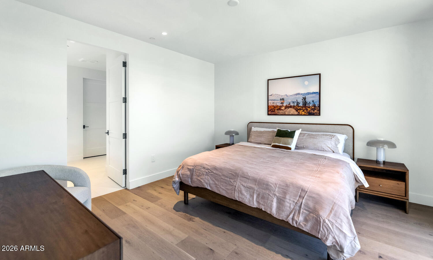 4849 North Camelback Ridge Road, Unit B203 Scottsdale, AZ 85251 - Photo 13 of 30 a bedroom with a bed and a painting on the wall