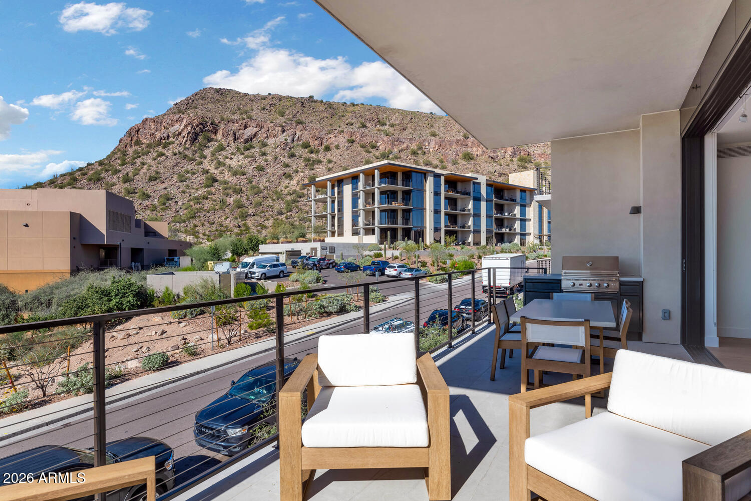 4849 North Camelback Ridge Road, Unit B203 Scottsdale, AZ 85251 - Photo 20 of 30 a view of a patio with couches table and chairs with wooden floor