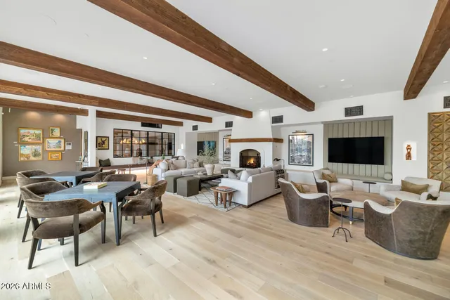a living room with fireplace furniture and a flat screen tv
