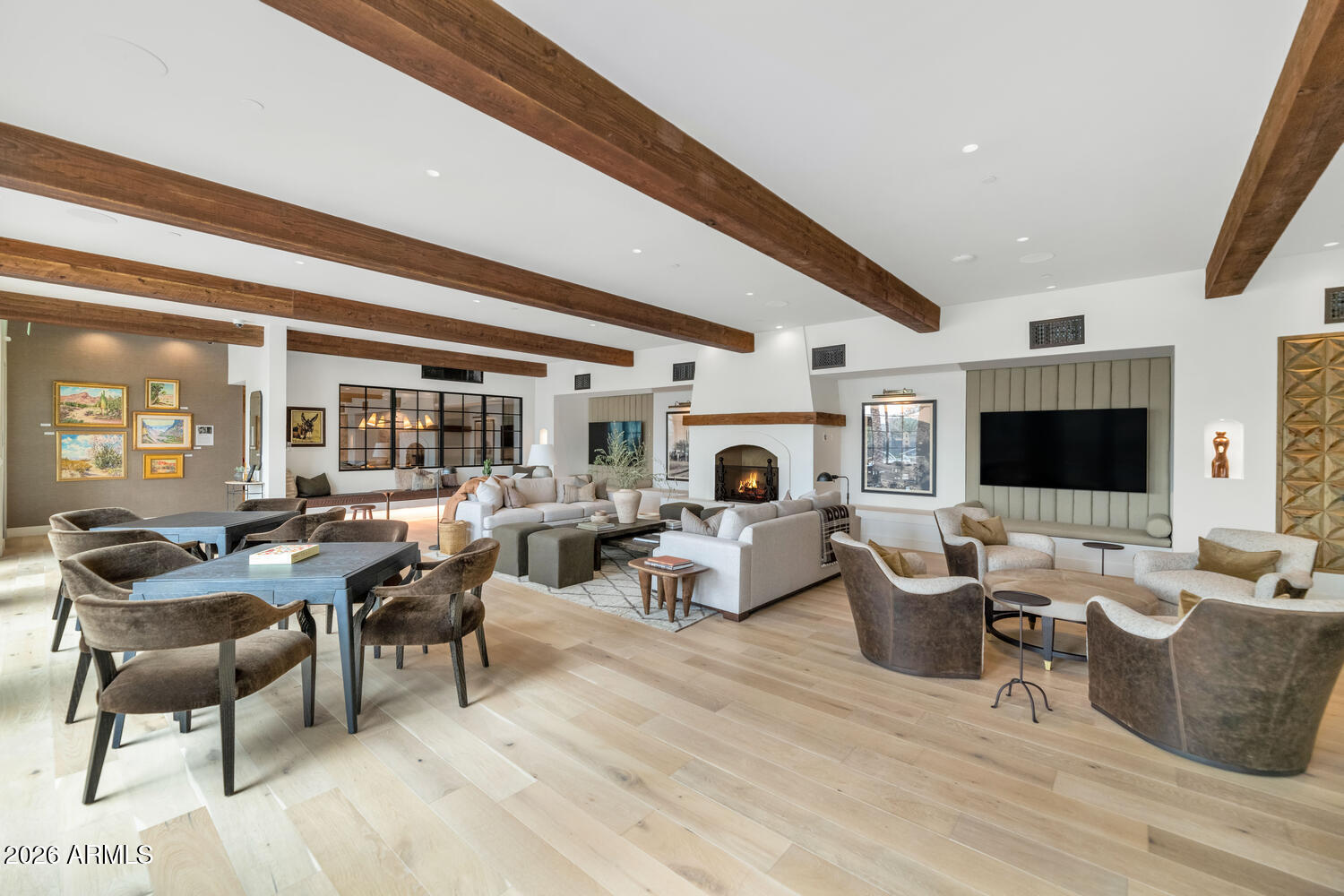 4849 North Camelback Ridge Road, Unit B203 Scottsdale, AZ 85251 - Photo 23 of 30 a living room with fireplace furniture and a flat screen tv