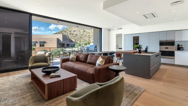 a living room with furniture and a large window