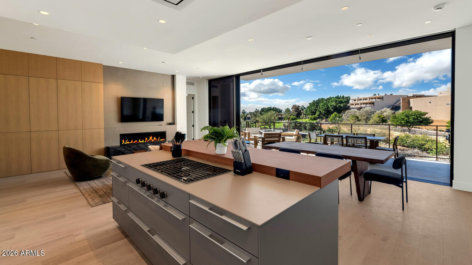 4849 North Camelback Ridge Road, Unit B203 Scottsdale, AZ 85251 - Photo 5 of 30 a living room with furniture a flat screen tv and a floor to ceiling window