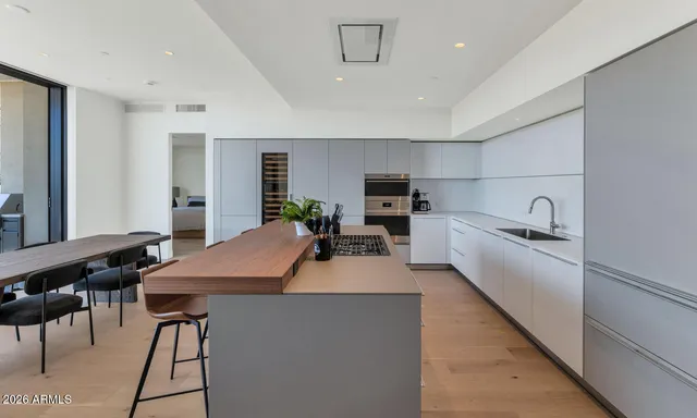 a kitchen with cabinets a sink and appliances