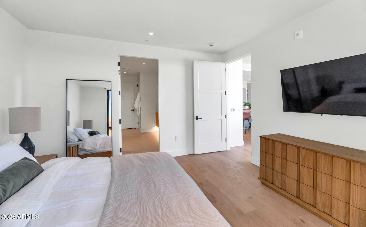 4849 North Camelback Ridge Road, Unit B203 Scottsdale, AZ 85251 - Photo 9 of 30 a bedroom with a bed and a flat tv screen