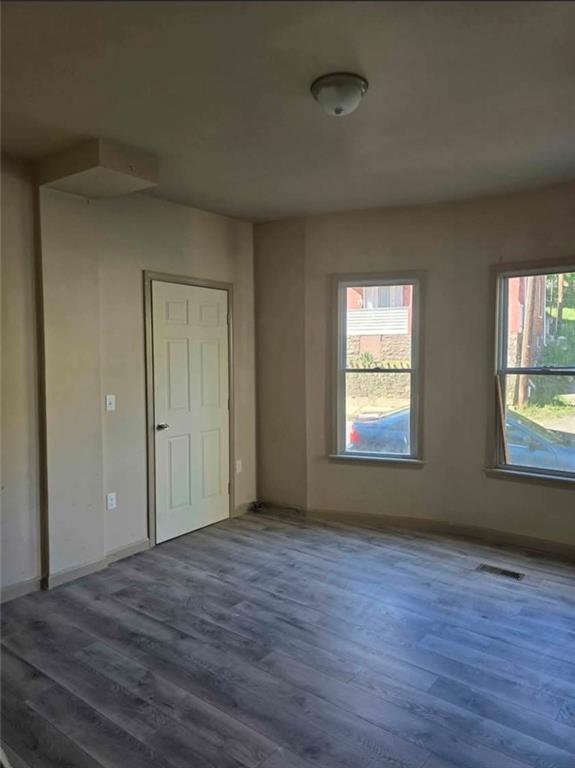 1001 19th Avenue Altoona, PA 16601 - Photo 15 of 19 an empty room with wooden floor and windows