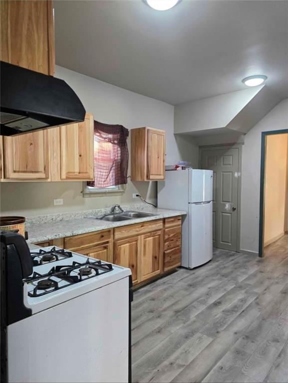 1001 19th Avenue Altoona, PA 16601 - Photo 6 of 19 a kitchen with a stove a sink and a refrigerator