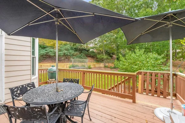 a view of a backyard with a garden and entertaining space