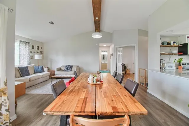 a kitchen with a stove a sink and a microwave