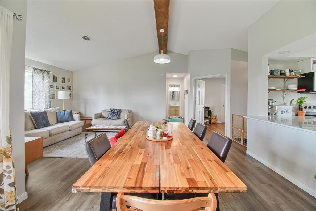 11074 State Highway 64 Overton, TX 75684 - Photo 19 of 40 a living room with dining room and wooden floor