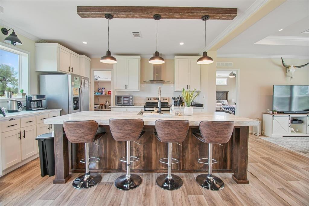 11074 State Highway 64 Overton, TX 75684 - Photo 23 of 40 a dinning area with chairs and wooden floor