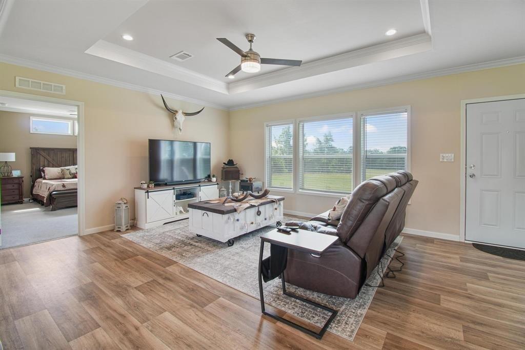 11074 State Highway 64 Overton, TX 75684 - Photo 24 of 40 a living room with furniture a flat screen tv and a large window