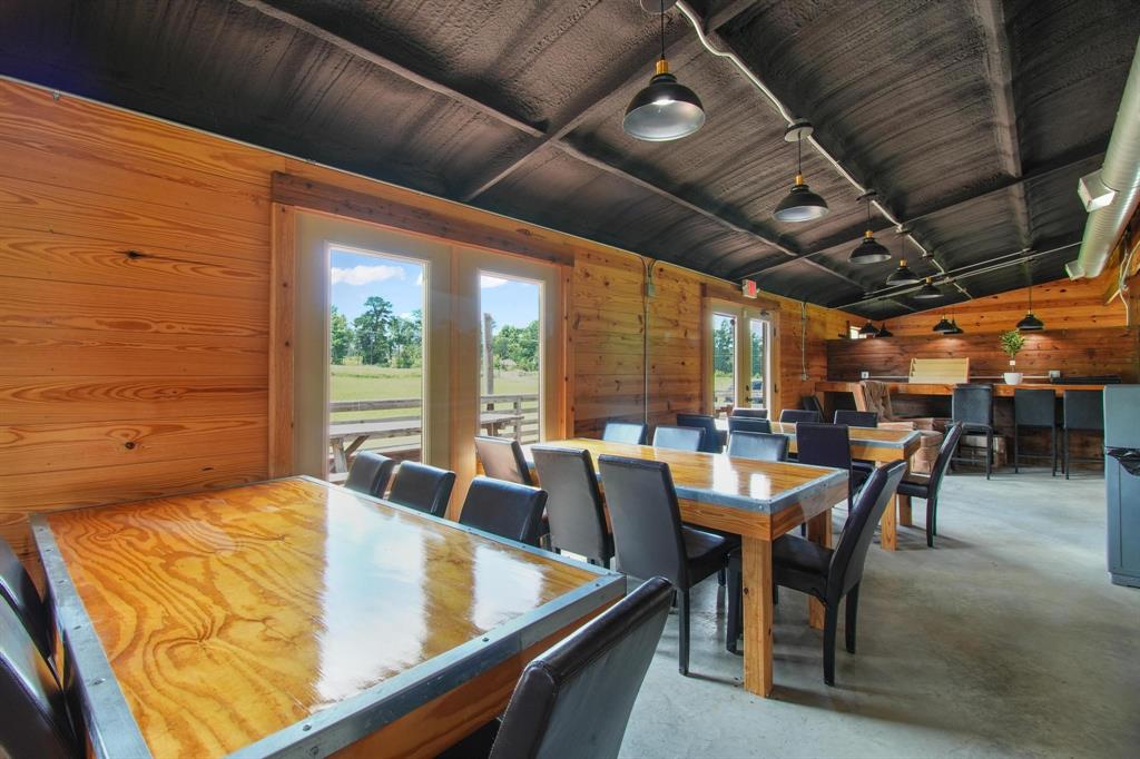 11074 State Highway 64 Overton, TX 75684 - Photo 31 of 40 a dining room with furniture and a large window