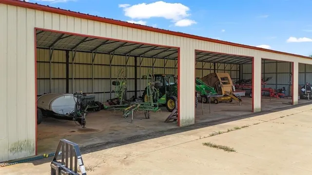 an aerial view of a house with big yard