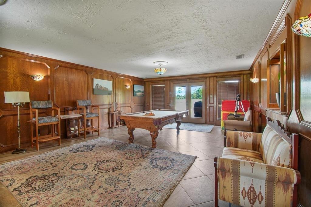 11074 State Highway 64 Overton, TX 75684 - Photo 8 of 40 a living room with furniture a large window and wooden floor