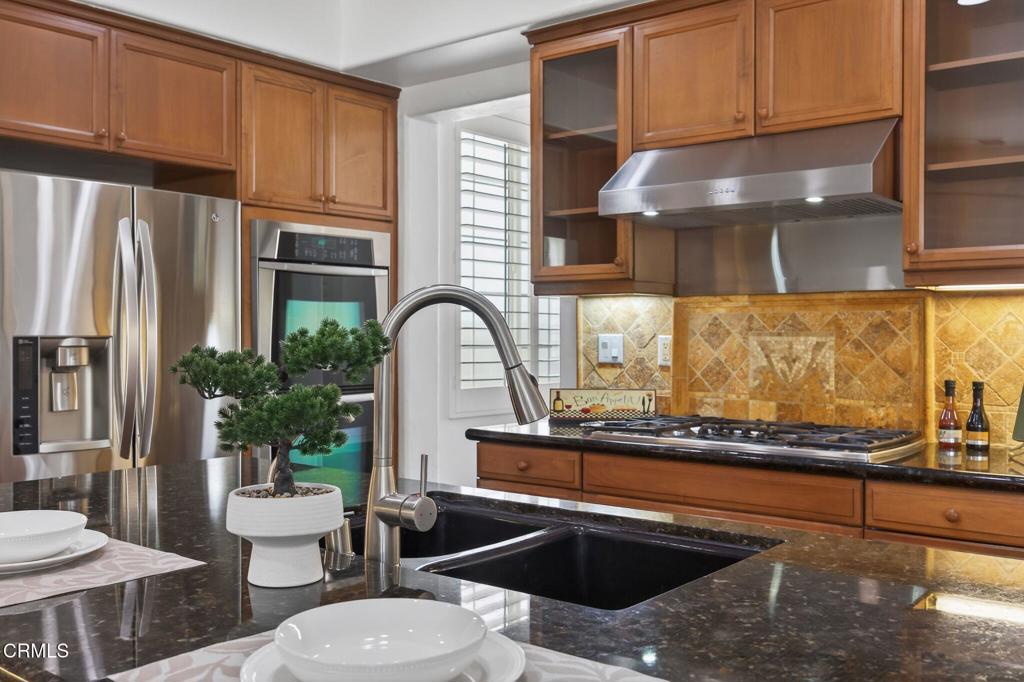 740 Freeport Lane Oxnard, CA 93035 - Photo 11 of 35 a kitchen with stainless steel appliances granite countertop a sink and a stove