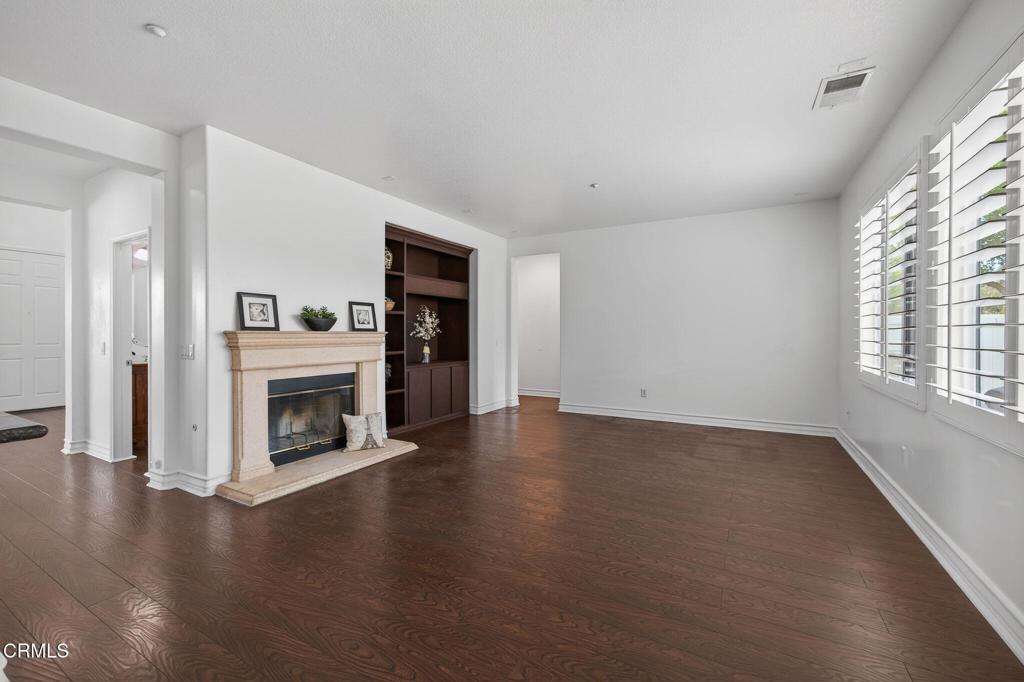 740 Freeport Lane Oxnard, CA 93035 - Photo 16 of 35 an empty room with floor to ceiling window and fireplace