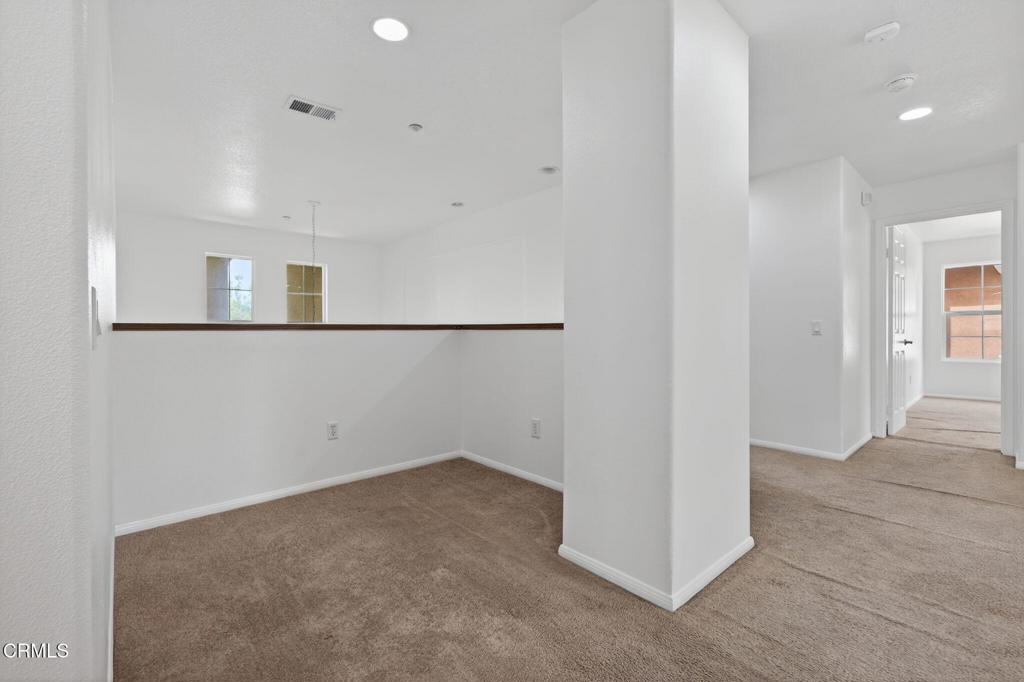 740 Freeport Lane Oxnard, CA 93035 - Photo 21 of 35 wooden floor in an empty room with a window