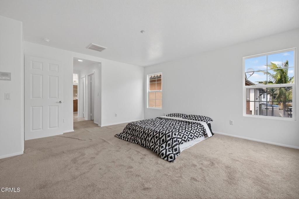 740 Freeport Lane Oxnard, CA 93035 - Photo 23 of 35 an empty room with windows and cabinet